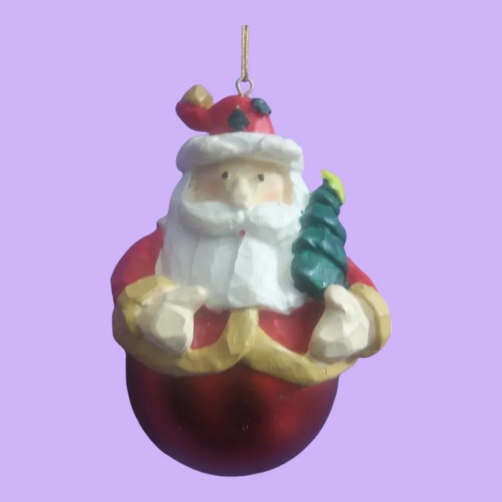 Round ball ornament bottom Santa with tree on hat and in hand in red and white